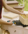 Using One-Hand Ratcheting Band Clamp For Quick Glue-Ups And Framing, 16-Inch Clamp With Self-Adjusting Corners on wooden box