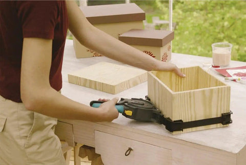 Using One-Hand Ratcheting Band Clamp For Quick Glue-Ups And Framing, 16-Inch Clamp With Self-Adjusting Corners on wooden box
