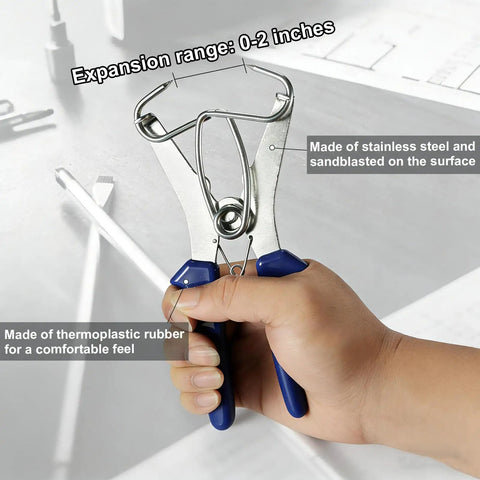 Hand holding spring loaded pliers from 20 Piece Stainless Steel Miter Spring Clamps Kit With Spring Loaded Pliers For Woodworking Picture Frames And Wood Trim Moldings Built Tough Rust Resistant Heavy Duty Clamping For Crafts Boss Grade Quality