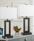 Pair Of Dope Modern Touch Control Bedside Lamps With USB Ports, 22 Inch Tall Nightstand Lights, black base, white shades, on table.