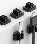 5 Pack Cable Spring Holder Clips For Desk Organization with USB and HDMI cables attached, shown on a white surface