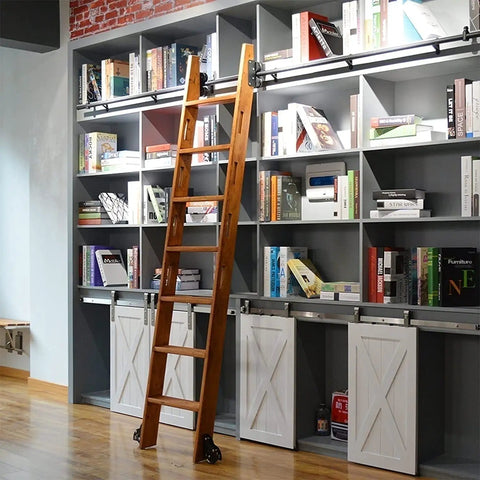 Built Like A Tank Rolling Ladder Track And Sliding Barn Door Hardware Kit For Your Sweet Loft Or Shed, Super Smooth Black Steel Stair Glide Rail With Heavy Duty Floor Casters, Hassle Free Library Setup with wooden ladder against gray shelves.