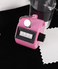 Dang Solid Four Digit Mechanical Tally Clicker Counter In Bright Pink with metal ring and lanyard for tracking sports and crafts.