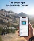Hand holding smartphone displaying SOLIX C1000 Portable Power Station app interface in outdoor setting with mountains in background