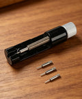 Watch Link Remover Tool With Micro Adjustment Slider For Stainless Steel Bands Includes Extra Pins And Spring Bar Tool on wood