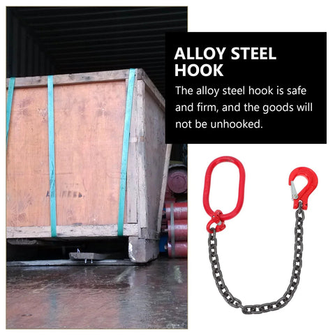 Lifting chain sling with red alloy-steel hooks on both ends beside a strapped wooden crate.