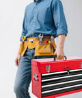 Person carrying a Badass 4 Drawer Tool Chest 21 Inch Steel Portable Toolbox with hand tools in a tool belt.