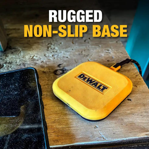 Yellow rugged non-slip wireless charger pad with Dewalt logo on a wooden surface, includes Type-C cable for Qi charging.