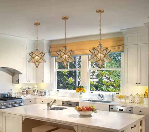 Moravian Star Pendant Light In Brass With Clear Glass Shade, 15 Inch Modern Transitional Fixture For Living Room in kitchen setting