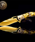 Titanium Plated Wolf 3D Relief Handle Folding Pocket Knife with Dope 440 Steel Blade, gold finish, on black background