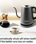 Gooseneck Electric Kettle 0.8L Fast Boil For Pour Over Coffee And Tea With One Touch Operation Auto Shut Off Boil Dry Protection Ultra Fast Hot Water Black Kitchen Essential on counter next to coffee and cup.