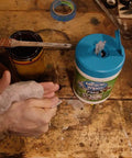 Hands using Paint Prep And Cleanup Wipes That Wipe Away Wet Paint Caulking Epoxy And Colorant From Hands Surfaces And Tools Fast