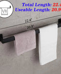24 Inch Contemporary Stainless Steel Towel Bar Wall Mount With Slick Matte Black Finish, holding towels, shown on wall