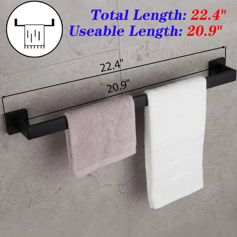24 Inch Contemporary Stainless Steel Towel Bar Wall Mount With Slick Matte Black Finish, holding towels, shown on wall