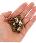 50 Piece Top Shelf Heavy Duty U Nut Fasteners Golden Captive Clips For Car Bumper And Grille Mounting held in hand.
