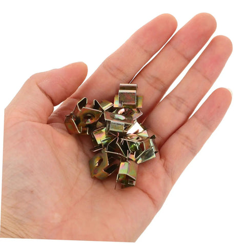 50 Piece Top Shelf Heavy Duty U Nut Fasteners Golden Captive Clips For Car Bumper And Grille Mounting held in hand.