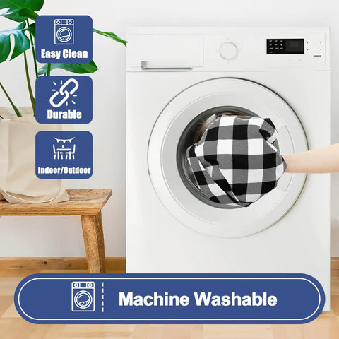 Hand placing Buffalo Plaid Waterproof 3 Piece Picnic Table Cover Set into washing machine, showcasing easy clean feature.