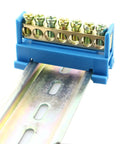 Seven Position Terminal Block Bus Bar With Brass Screw Terminals For DIN Rail Grounding Strip Easy Snap In Mount Fifty Millimeter Long Six Millimeter Holes M5 Screws Copper Bar Height Nine Millimeter Bottom Mount Cold Pressed Copper installed on rail.