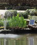 10W Solar Water Pump Kit With 18V Panel For Fish Pond And Fountain Includes Brushless Submersible Pump in garden pond setting.