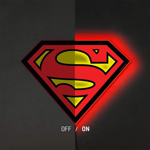 Superman Table Lamp And Night Light With Luminescent Halo, 3D S Shield Crest Wall Light Mountable shown half off half on with glow