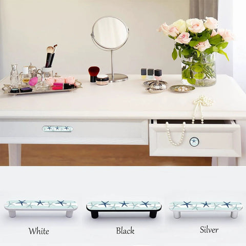 Blue Starfish Cabinet Pulls 4 Pack Center To Center Three Quarter Inch Silver Nautical Drawer Handles installed on white furniture.