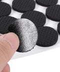 Close-up of 30 Piece Black Nonslip Rubber Feet Pads For Durable Floor Protection Of Furniture And Appliances That Prevent Scratches.