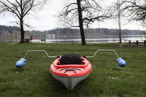 Kayak Stabilizers Package With Hard Outrigger Floats Adjustable Stabilizer System For Fishing Kayaks displayed on grass