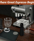 7 Piece 51mm Espresso Accessories Kit With Spring Loaded Calibrated Tamper WDT Tool Dosing Funnel 75ml Dosing Cup Double Walled Espresso Cup Puck Screen Mat Barista Grade Gear displayed with espresso machine