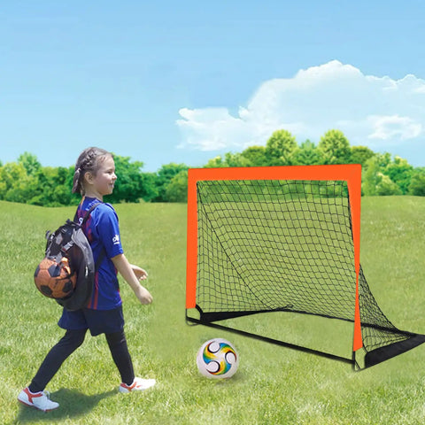 Child walking towards 2 Pack 4 Ft By 3 Ft Portable Kid Soccer Goals For Backyard Indoor And Outdoor Pop Up Play In Orange Easy Setup Sturdy Trapezoidal Frame With Ground Spikes And Includes Storage Bags