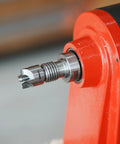 Close-up of BMWOOD 4-prong spring-loaded spur drive center mounted in red wood lathe spindle, 2MT, 1-inch diameter.