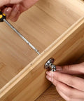 Installing Vintage Drop Cabinet Pulls Polished Nickel Zinc Alloy Retro Dresser Knobs And Drawer Handles on a wooden drawer