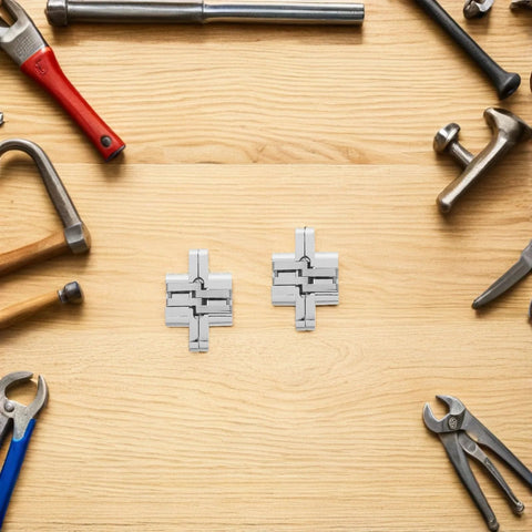 Concealed 43mm Zinc Alloy Hinges Set for Jewelry Boxes and Cabinets, four-piece cross folding hidden hinges displayed on a wooden surface.