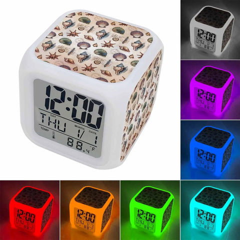 Top Notch Silent Digital Alarm Clock With Cool Starfish Shell Shape And Gentle Nightlight For Bedrooms Or Work Desks shows time, date, temperature.