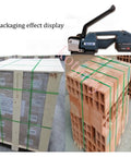 Portable Electric Strapping Machine With Two Batteries For PP PET Band Belt Packing Tools secures pallets with green straps.