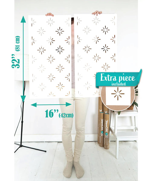 Starburst Geometric Wall Stencil Kit 2 Pack Of 16.5 X 31.5 Inch Stencils held up to show size and pattern design