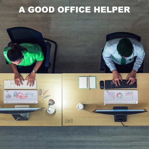 Top view of two people working at desks with computers, using Compact Glass Dry Erase Whiteboard With Built In Keyboard Stand And Drawer.