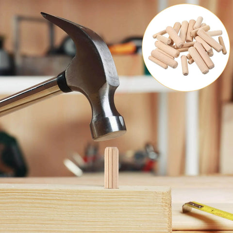 Hammer installing fluted dowel from Thirty Piece Wood Dowel Set With One Quarter Inch, Three Eighths Inch, And Five Sixteenths Inch Hardwood Fluted Dowels For Woodworking Crafts Furniture DIY Projects Grooved Pins And Pegs Pro Grade Tough And Ready For Any Build into wood surface, with dowels in inset.