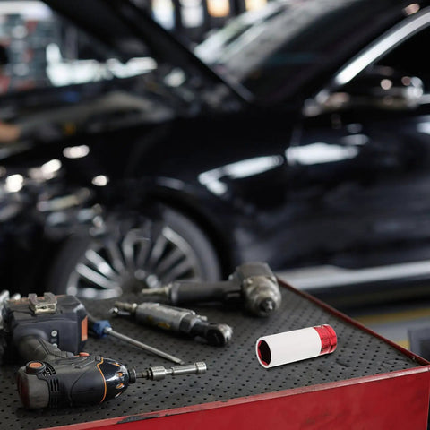 Top Tier Impact Socket Set For Automotive Repairs. Four piece color coded wheel protectors on a workbench for lug nut removal.