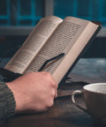 Person using Oak Wood Book Stand With Adjustable Tilt For Reading And Cooking, Cookbook Holder, Durable Wooden Book Holder For Kitchen.