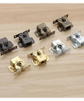 Cool 10 Pack Cabinet Latch Catches With Built-in Spring Auto Locks To Secure Wardrobes Cupboards And Kitchen Drawers on a wood surface.