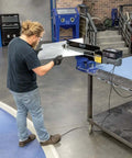 Man operating Budget-Friendly 19 Inch Metal Bead Roller With Power Drive System and Dies for One-Person Operation in workshop