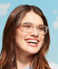 Woman wearing Rectangle Safety Glasses Z87.1 Certified, Lightweight Poly Lenses with a clear frame, suitable for narrow faces.