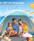 Family inside Large Beach Tent Sun Shelter For Three To Four People With UPF 50 Plus UV Protection Privacy Door on a sunny beach
