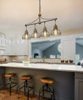 Industrial 3 Light Pendant Light For Kitchen Island With Clear Glass Shades Farmhouse Chandelier Cluster Pendant Fixture In Vintage Black Metal Frame For Dining Room hanging over kitchen island