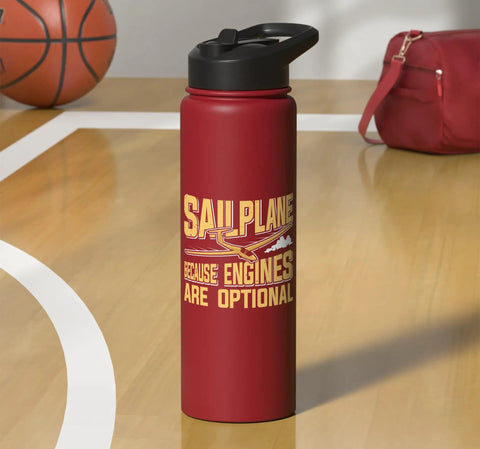 Red insulated stainless steel water bottle for sailplane pilots and glider enthusiasts on a basketball court, with a strap bag nearby.