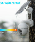 Solar Powered Outdoor Security Camera 2K with 360 Degree Pan Tilt on tree trunk in rain, showing weatherproof design