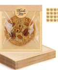 Single kraft bakery bag with window displaying cookie, includes thank you sticker, part of 120 Pack Self Sealing Kraft Bakery Bags With Window 5.7x6.5 Inches Heat Sealable And Grease Resistant To Go Sleeves For Donuts Scones Brownies Waffles Snacks Value Pack.