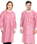 Two people wearing Pink Disposable Lab Coat 2XL Unisex SMS 45GSM breathable with snap front and knit collar cuffs, three pockets visible.