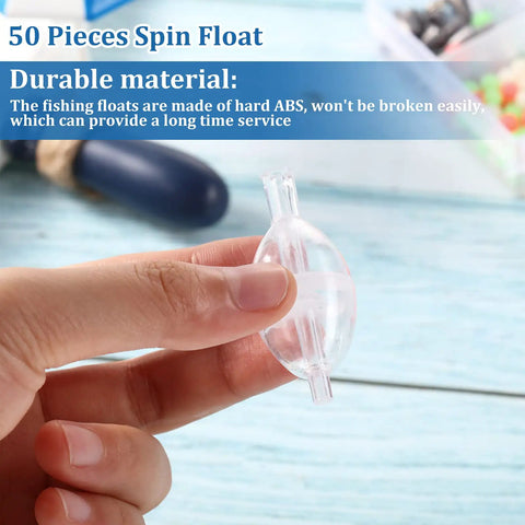 Hand holding a transparent ABS spin float from 50 Pieces Spin Floats Fishing Bobbers Set For Slip Cast And Spin Casting