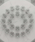 Circular arrangement of Crystal Glass Cabinet Knobs 10 Pack With Chrome Base White Finish Drawer Pulls for Furniture on marble surface